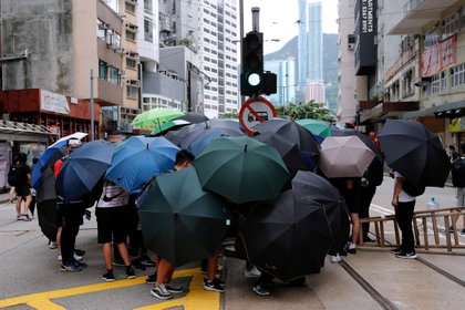 El paraguas se ha convertido en un símbolo de las manifestaciones pro democracia en Hong Kong. Foto: REUTERS/Tyrone Siu 