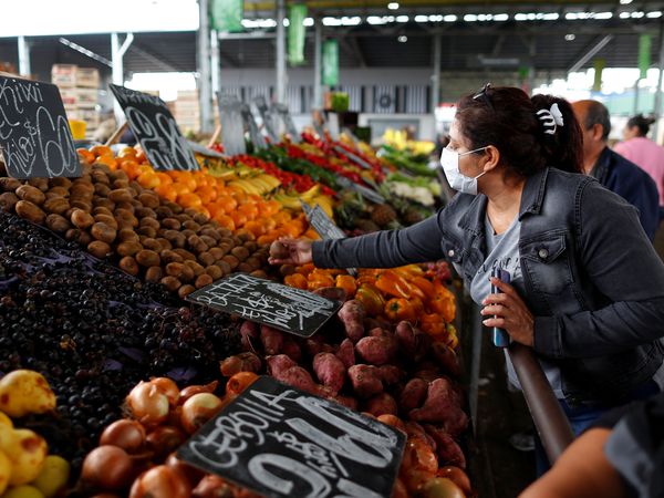 A woman shops wearing a face mask as a preventive measure against the coronavirus disease (COVID-19) spread, at wholesale food market Mercado Central (central market), in La Matanza, on the outskirts of Buenos Aires, Argentina April 1, 2020. REUTERS/Agustin Marcarian
