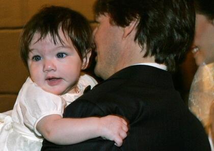 Actor Tom Cruise holds his daughter Suri as he arrives with his fiancee Katie Holmes (R) at a restaurant in Rome November 16, 2006. The couple are tipped to have chosen a 15th century castle just outside of Rome as the location for their celebrity wedding.