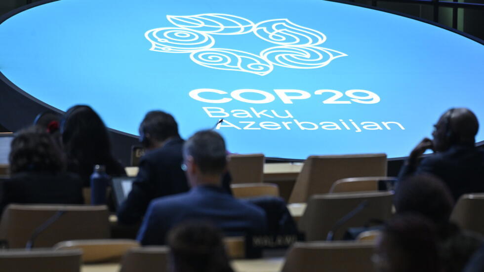 Unos participantes en la conferencia sobre el clima COP29, el 13 de noviembre de 2024 en Bakú