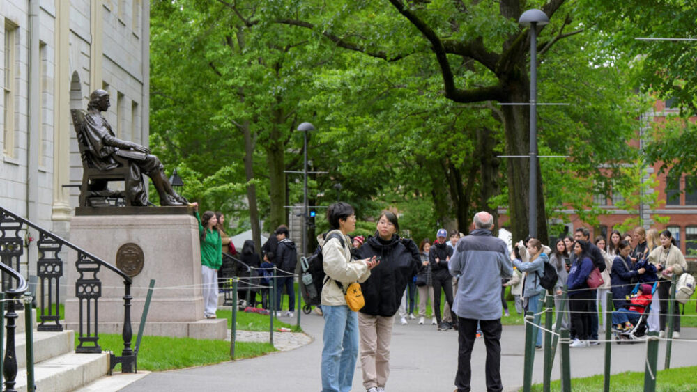 Students walks on the campus of Harvard University in Cambridge, Massachusetts, U.S., May 23, 2025.