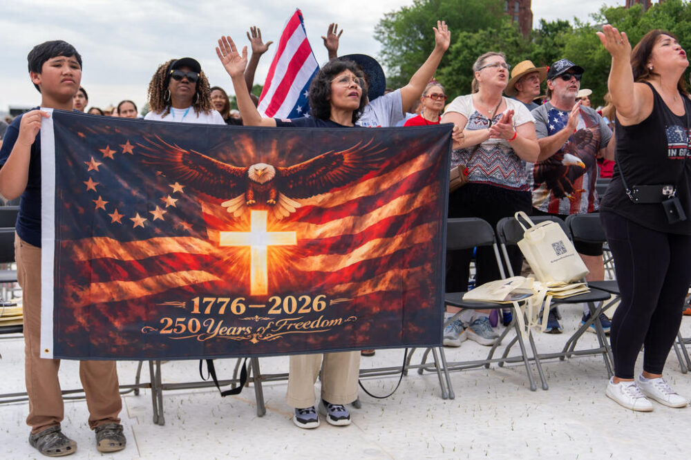 People worship to Christian music at Rededicate 250, a mostly conservative Christian prayer gathering in honor of the United States' 250th anniversary, on the National Mall, Sunday, May 17, 2026, in W